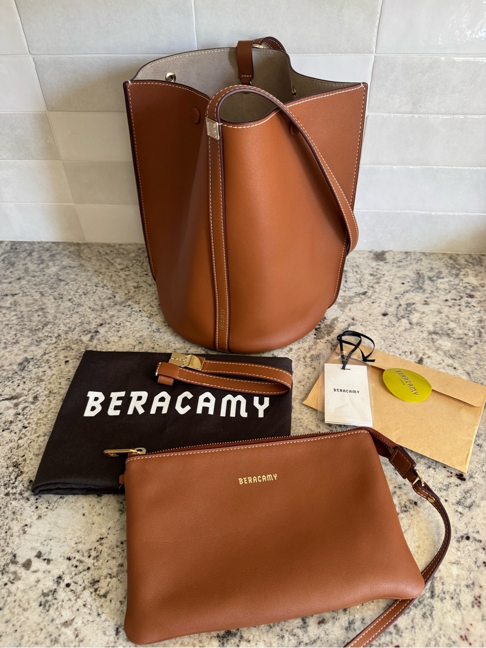 Beracamy Orukami Flat Hook Convertible Bucket bag with gold hardware caramel
